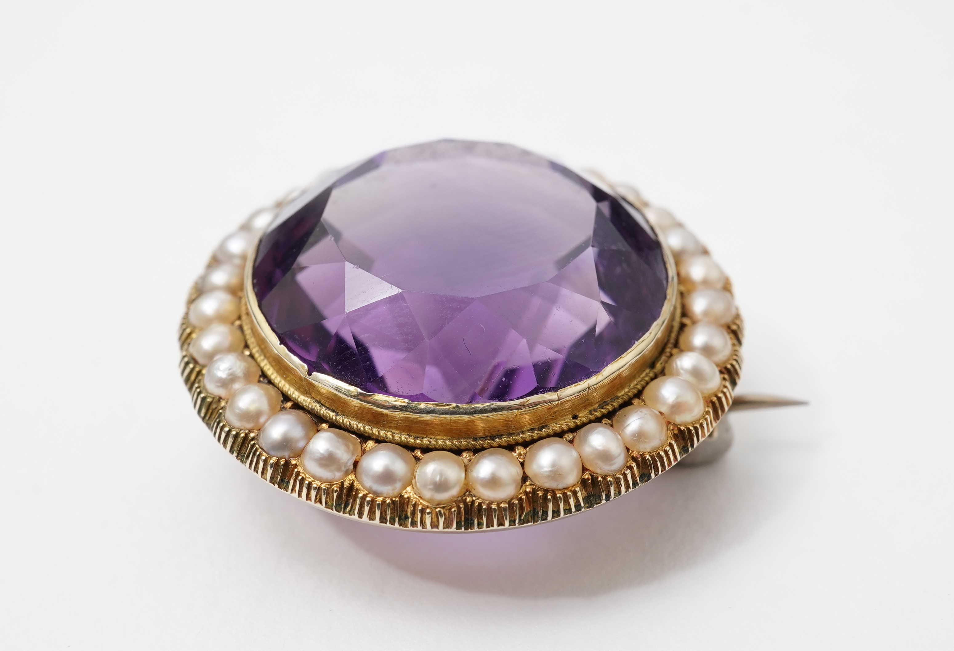 An Edwardian amethyst and seed pearl brooch, early 20th century